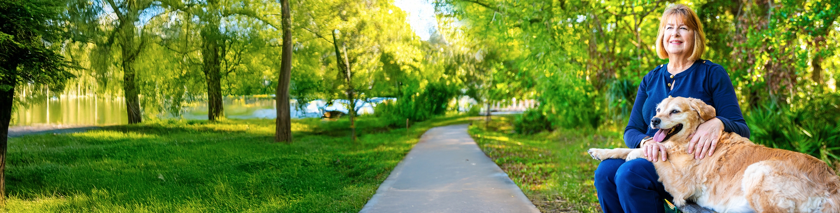 Woman sitting on a bench with her dog
